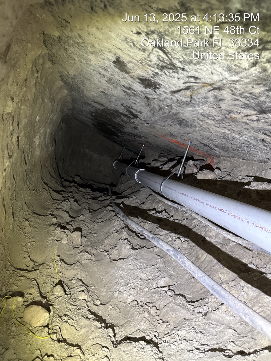 Schedule 40 PVC sewer replacement installed beneath a home by tunneling